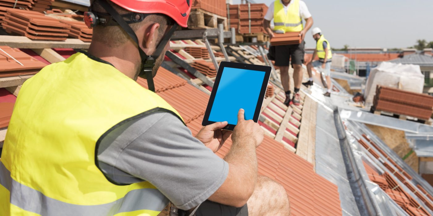 Roofer with ipad - layered version with bluescreen