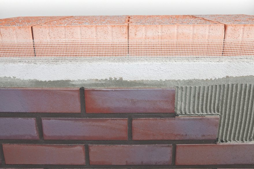 Laying of brick slips on poroton with mortar