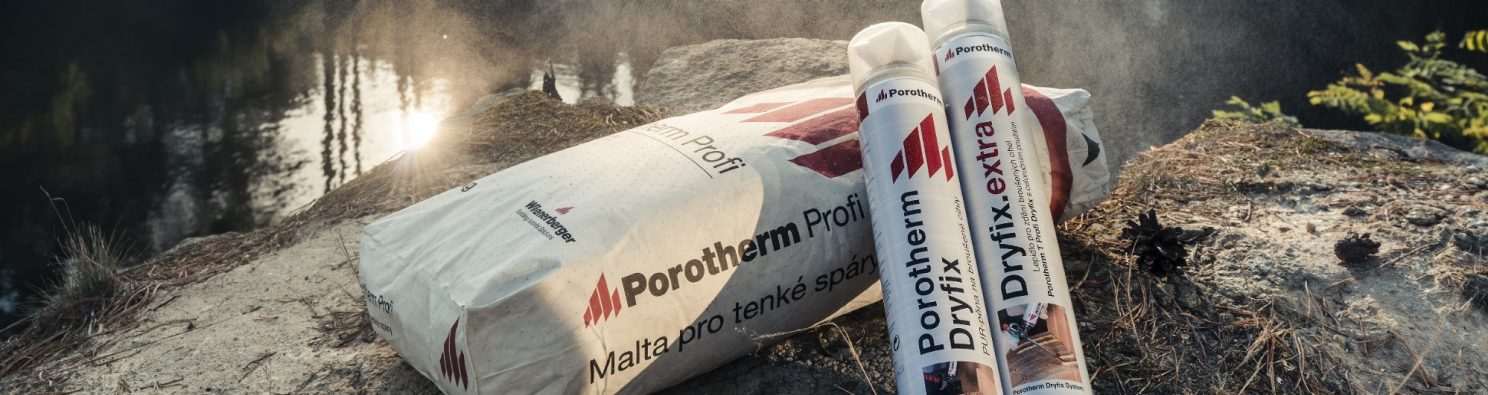 Mortar Porotherm Profi and masonry floam Porotherm Dryfix and glue Dryfix.extra in nature in the background of forest and quarry